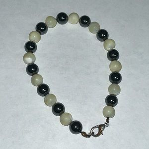 Hematite and Mother of Pearl Beads. 8 inch bracelet. Not stretchy.